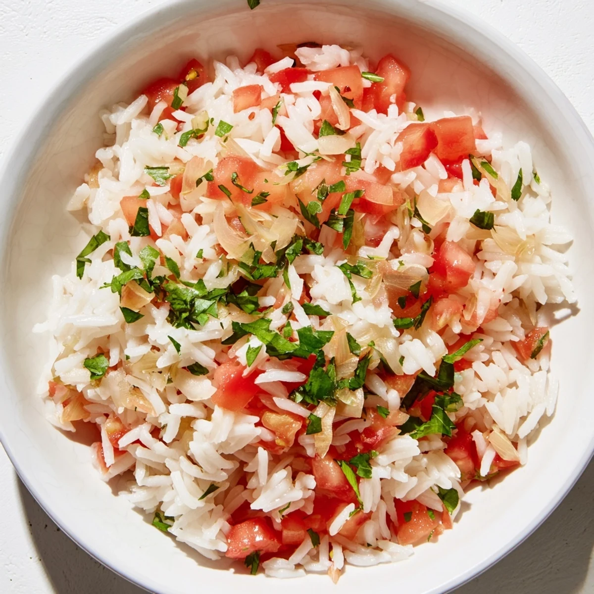 Hearty Tomato-Rice Skillet Dinner, featuring fluffy rice, vibrant tomatoes, and savory seasonings.