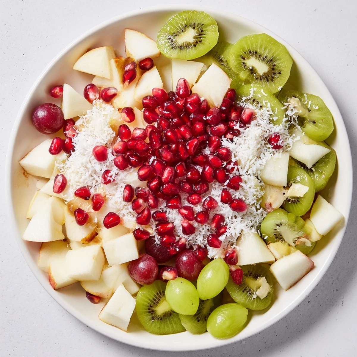 Bright, colorful Snowflake Fruit Medley, with a sweet citrus dressing, sprinkled with snowy coconut flakes.