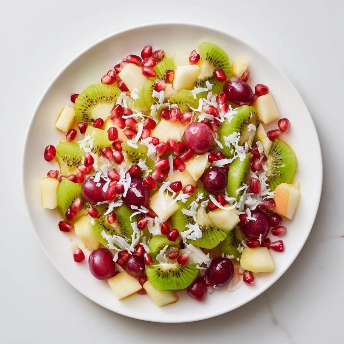A beautifully presented bowl of Snowflake Fruit Medley ready to serve as a dazzling winter dessert.