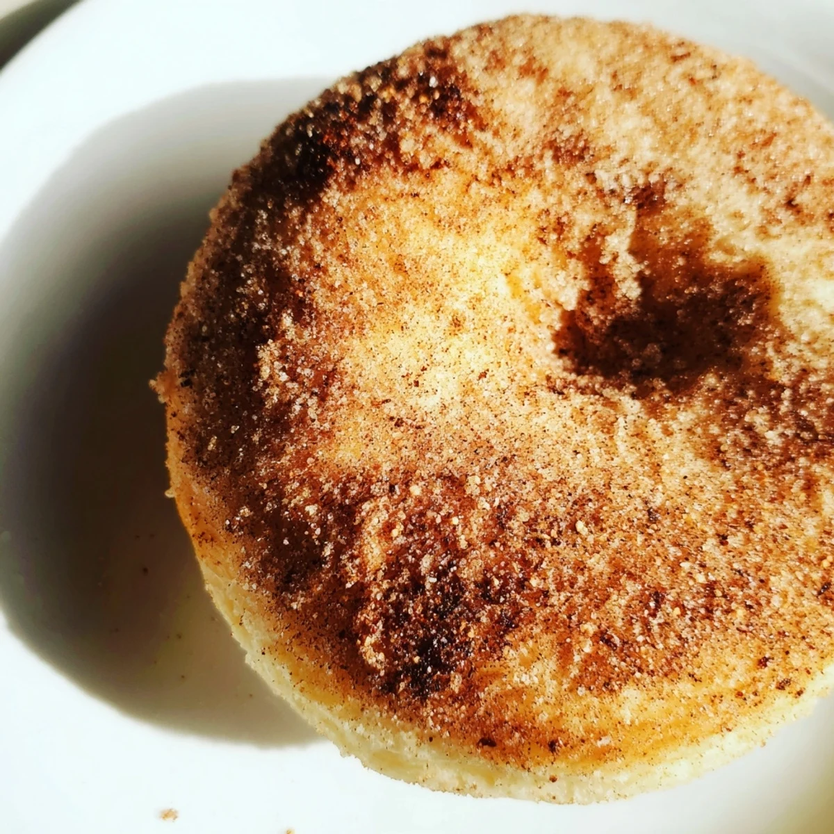 Close-up of fluffy cinnamon-sugar baked donuts, a simple, delicious treat ready to enjoy.