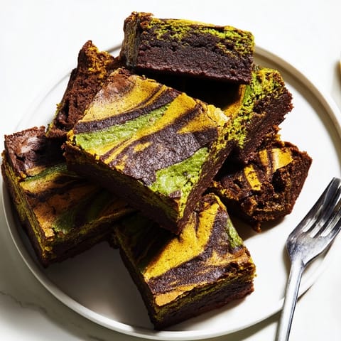 Delightful mini chai tiramisu cups layered with coffee-soaked ladyfingers and spiced cream.  