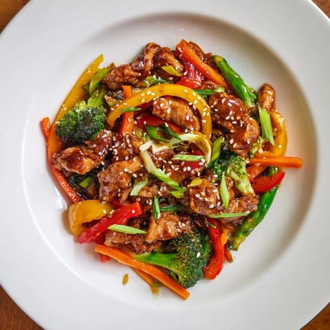 A delicious mix of tender chicken, vibrant vegetables and fluffy rice, this classic stir-fry awaits.