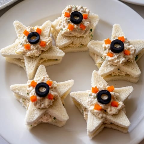 Freshly made Mini Starfish Sandwiches, a fun appetizer for kids, featuring tuna filling.