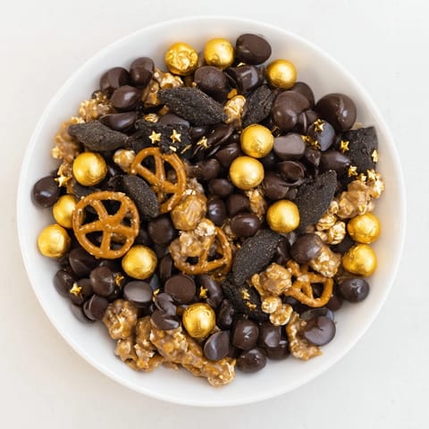 Close-up of the Gold and Black Midnight Snack Mix, beautifully arranged in a bowl, ready to serve.