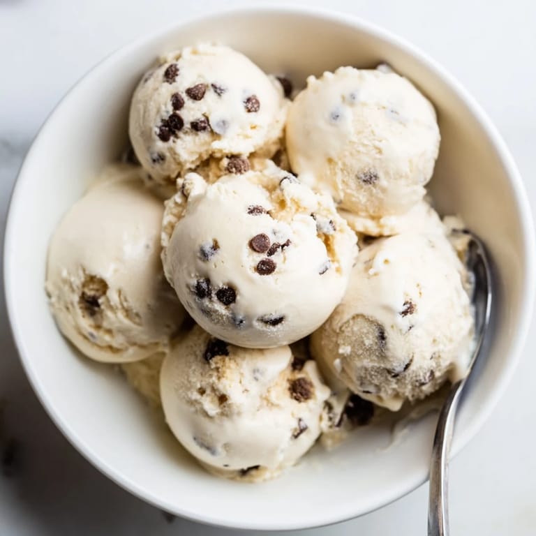 Refreshing cottage cheese ice cream with chunks of cookie dough, perfect for summer days.  