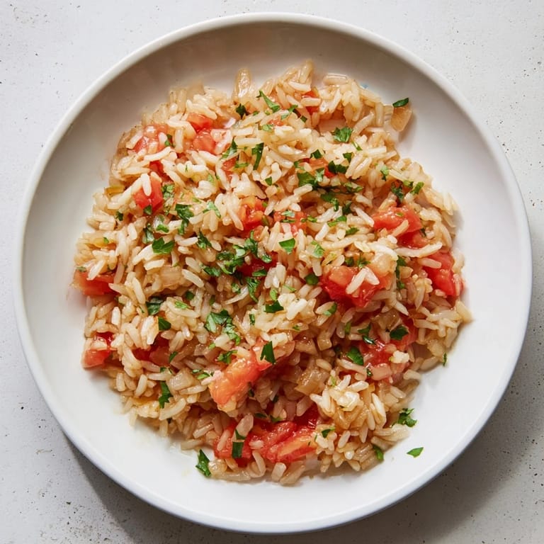 A comforting, vegetarian Tomato-Rice Skillet Dinner, ready in under an hour, served hot.