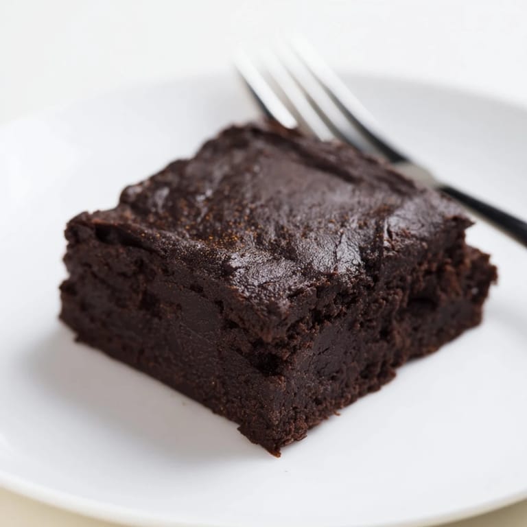 Perfectly square Pumpkin Workout Brownies with a fudgy texture, ideal for a post-workout recovery.