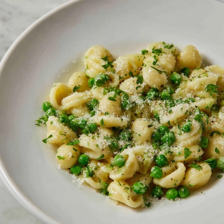 Classic garlic butter ditalini dish with peas, offering warm comfort and delicious weeknight ease.