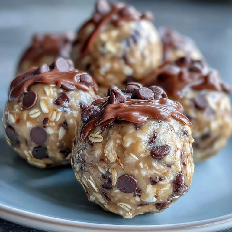 Homemade peanut butter energy balls with dark chocolate chips, ideal for meal prep and satisfying sweet cravings.